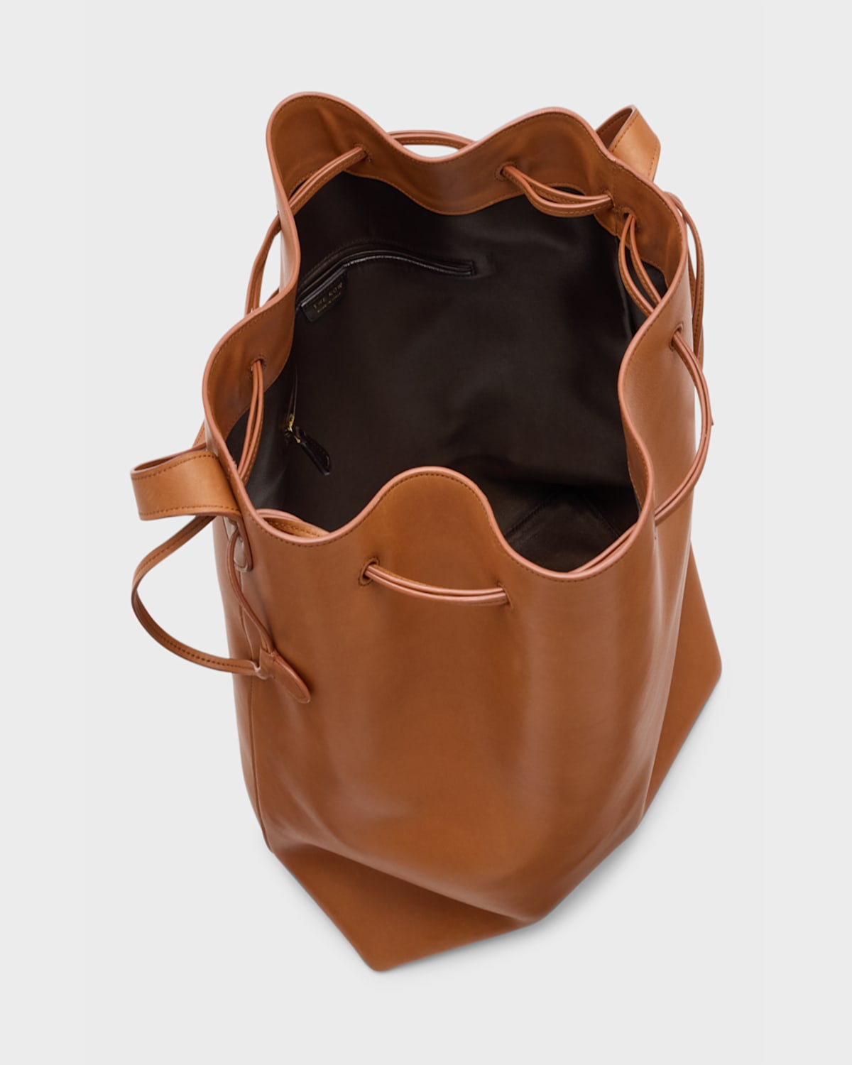 Shop The Row Belvedere Bucket Bag In Saddle Leather In Brandy
