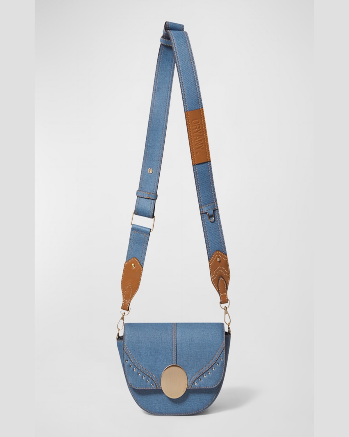 Oryany Lottie Denim Saddle Crossbody Bag In Denim Blue