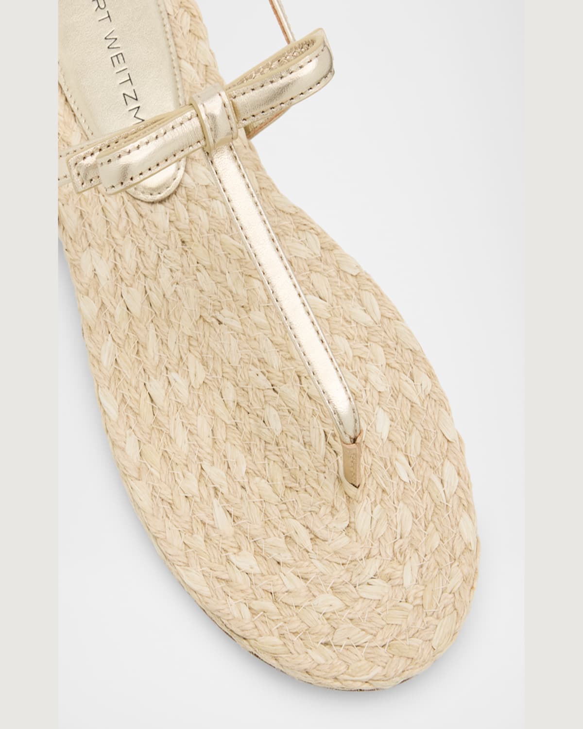 Shop Stuart Weitzman Felicity Metallic Bow T-strap Sandals In Light Goldnatural
