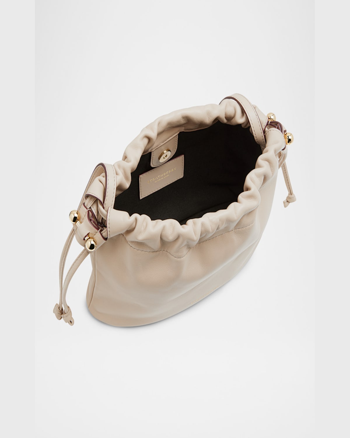 Strathberry Charlotte Drawstring Leather Clutch Bag In Oat