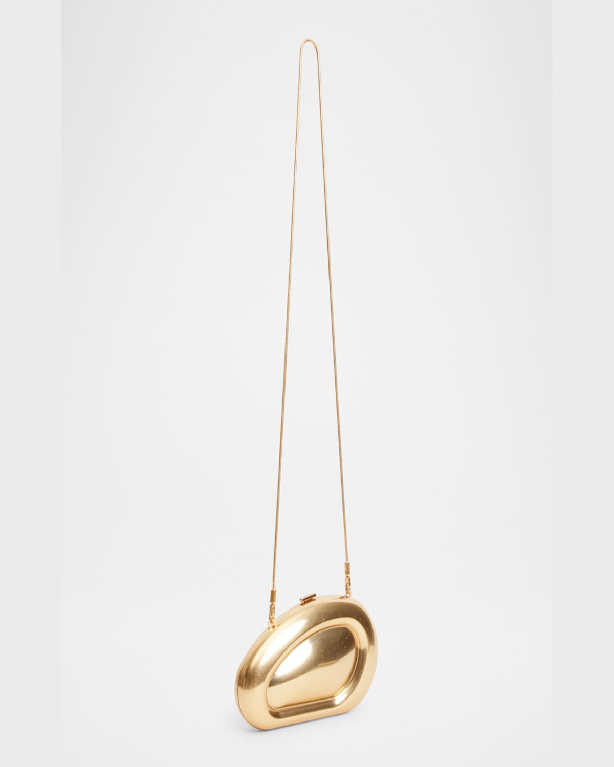 Simkhai Luna Oval Clutch Bag In Gold