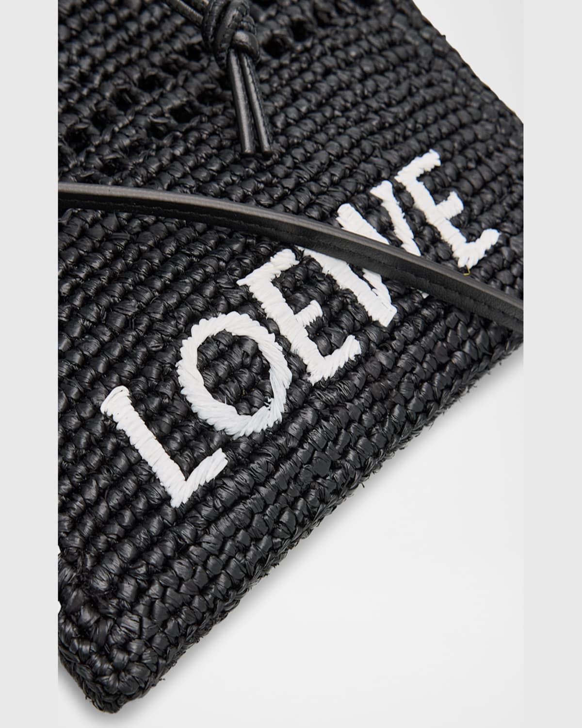 Loewe Drawstring Pocket Crossbody Bag In Raffia In Black