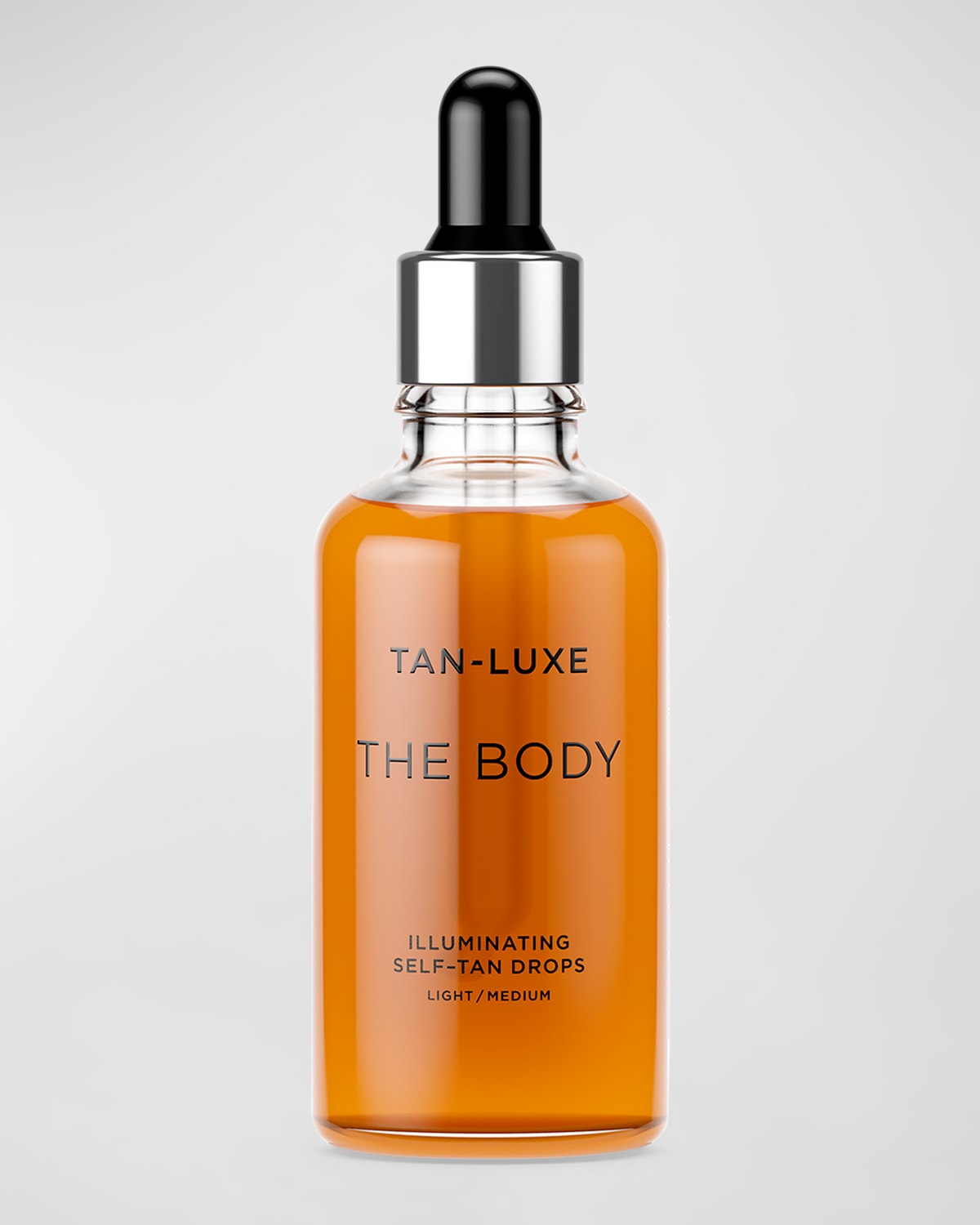 Shop Tan-luxe The Body Illuminating Self-tan Drops, 1.7 Oz. In Light/medium