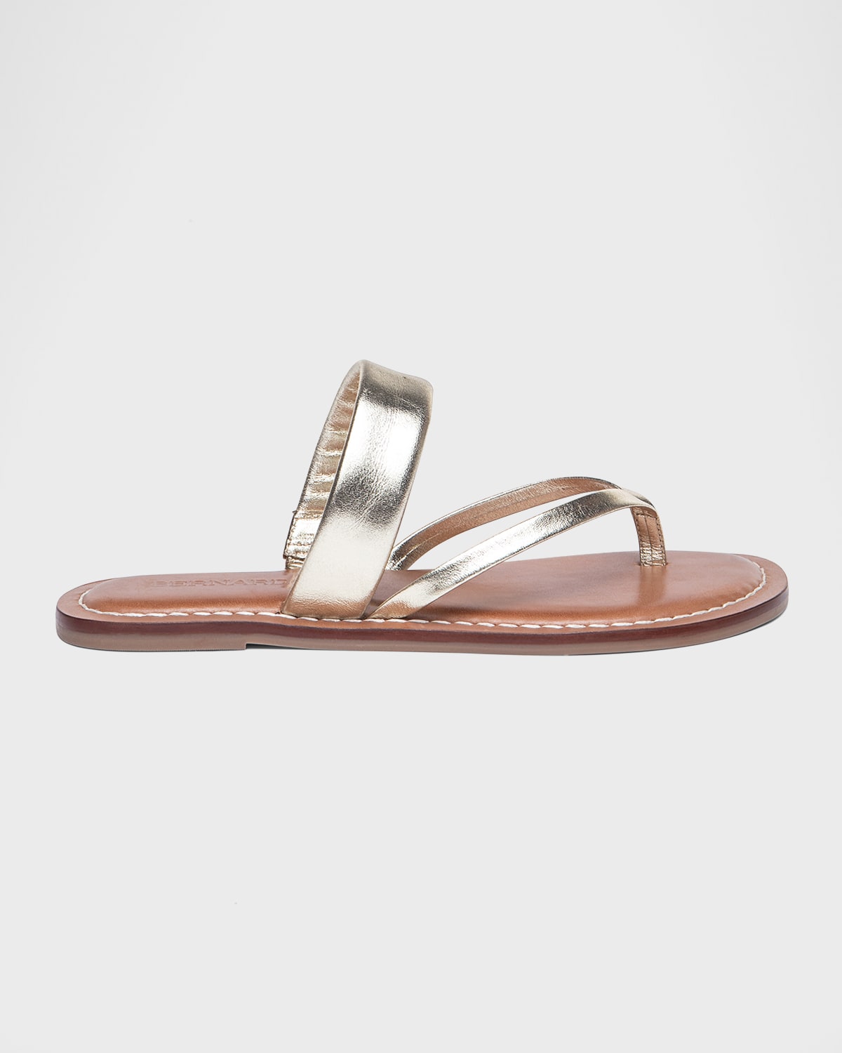 Shop Bernardo Leia Metallic Flat Thong Sandals In Champagne