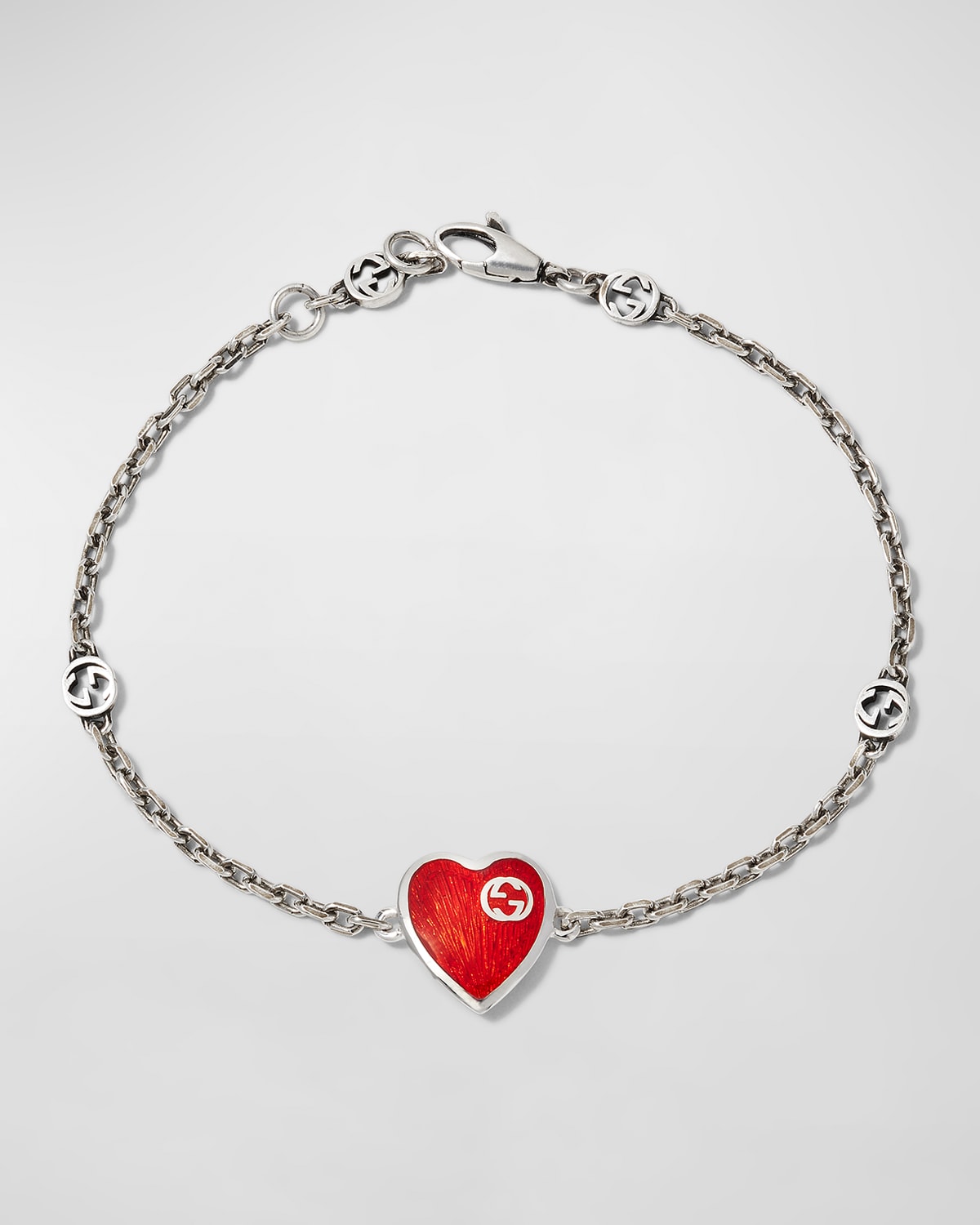 GUCCI STERLING SILVER HEART BRACELET WITH INTERLOCKING G