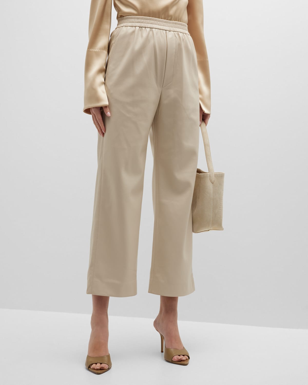 Shop Nanushka Odessa Flared Faux Leather Pants In Creme