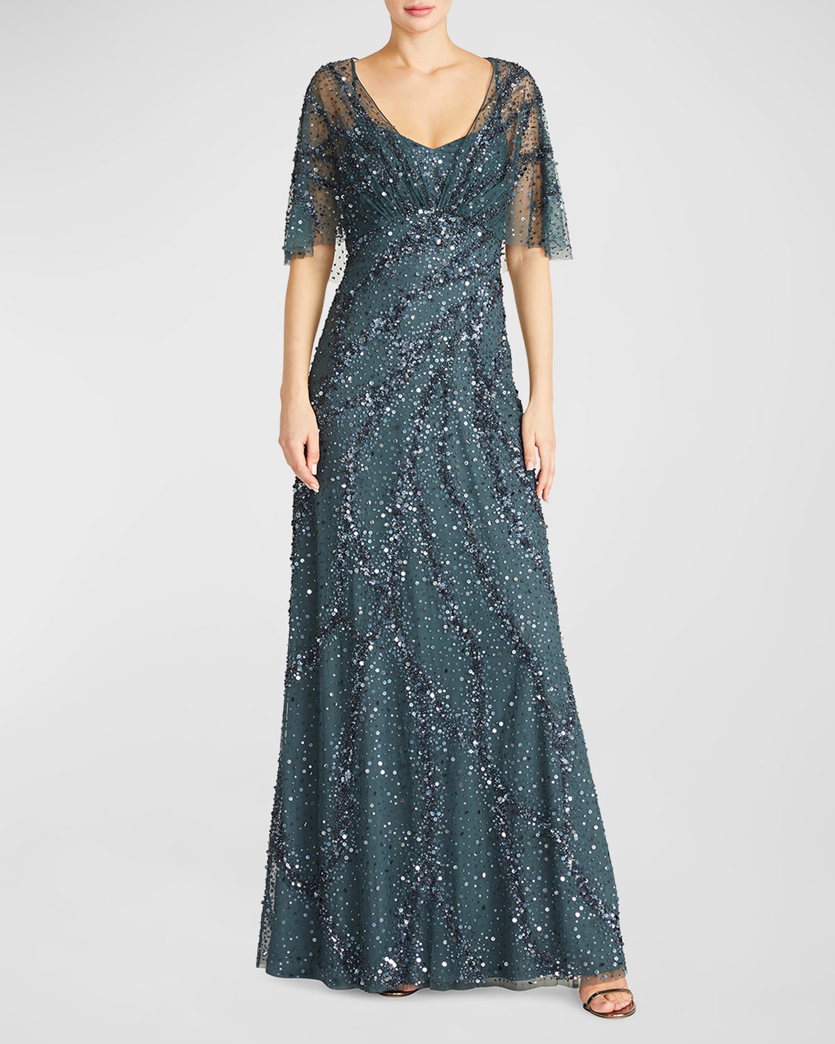 Theia Lavinia Sequin A-line Cape Gown In Nile Blue