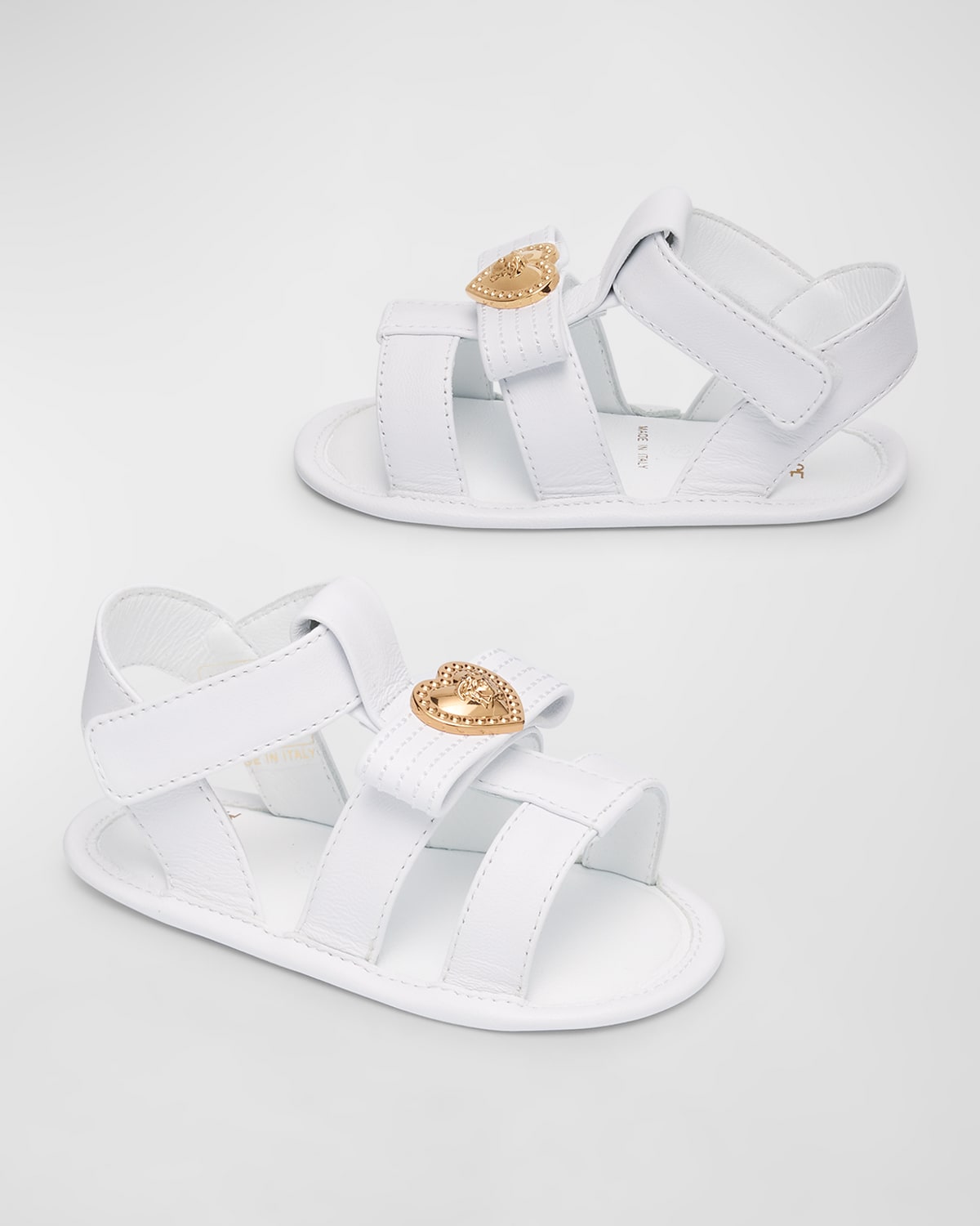 Shop Versace Girl's Leather Sandals W/ Medusa Pendant, Baby In White Gold