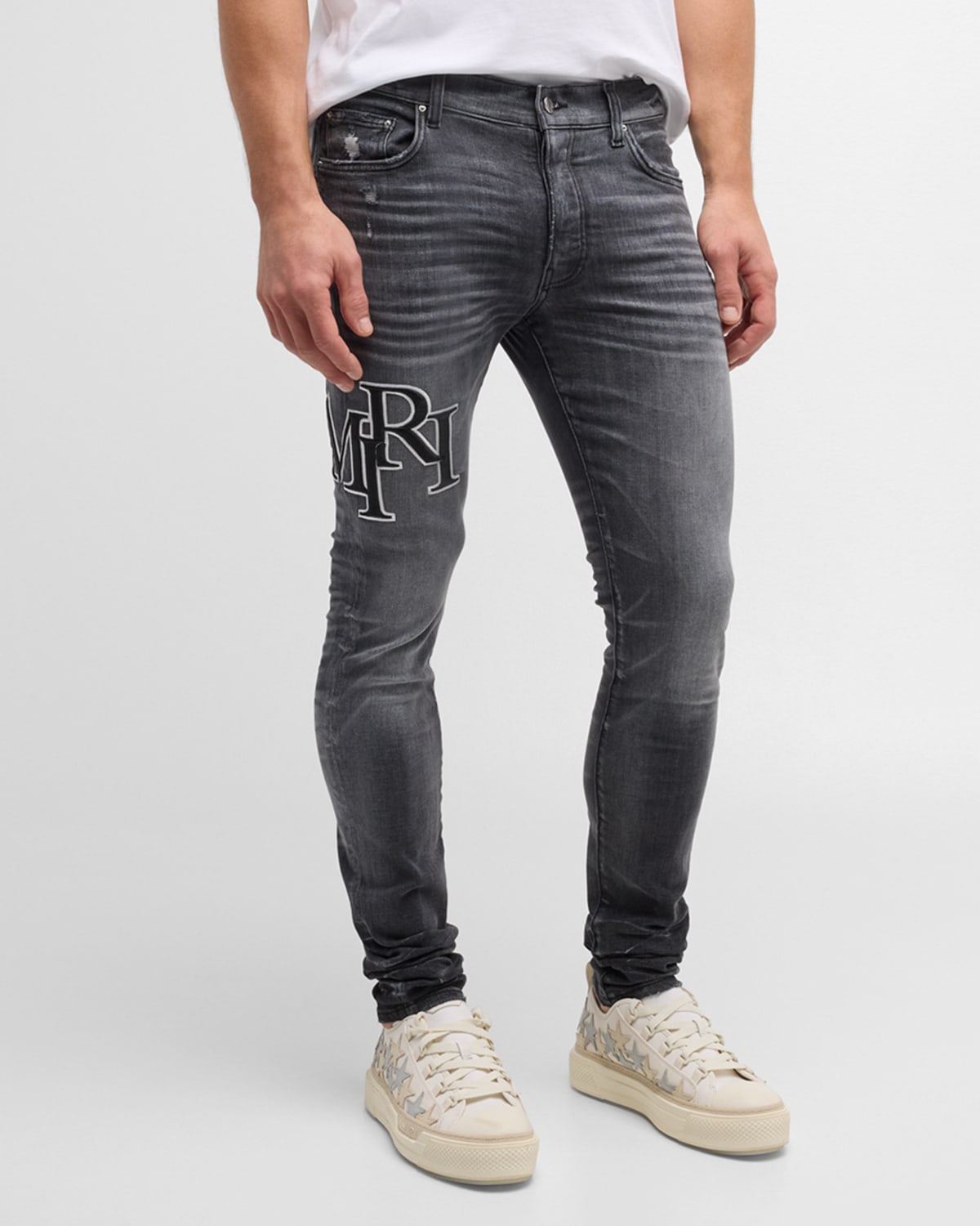 Shop Amiri Men's Faded Skinny Jeans With Staggered Logo In Faded Black