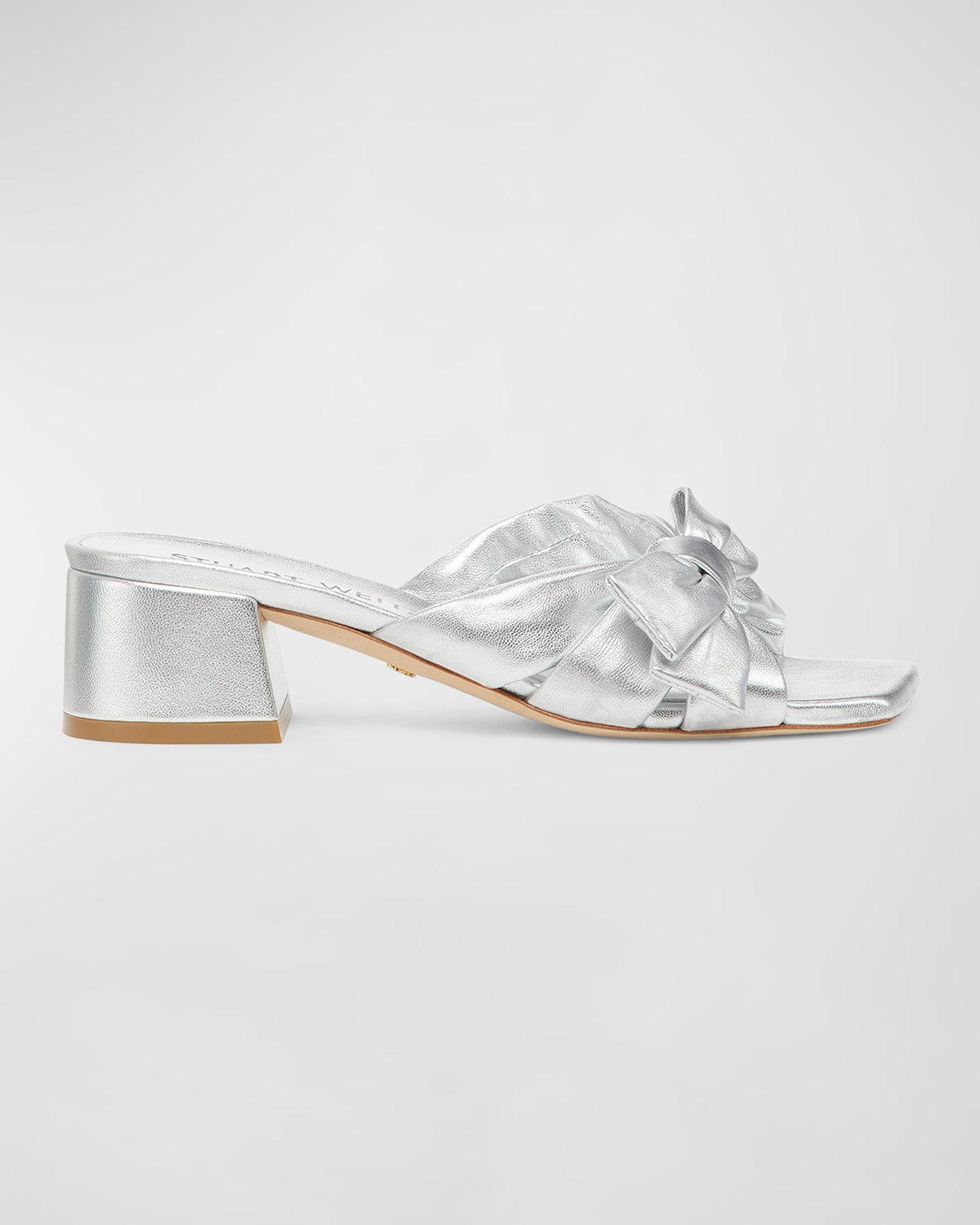 Shop Stuart Weitzman Sofia Metallic Leather Bow Mule Sandals In Silver