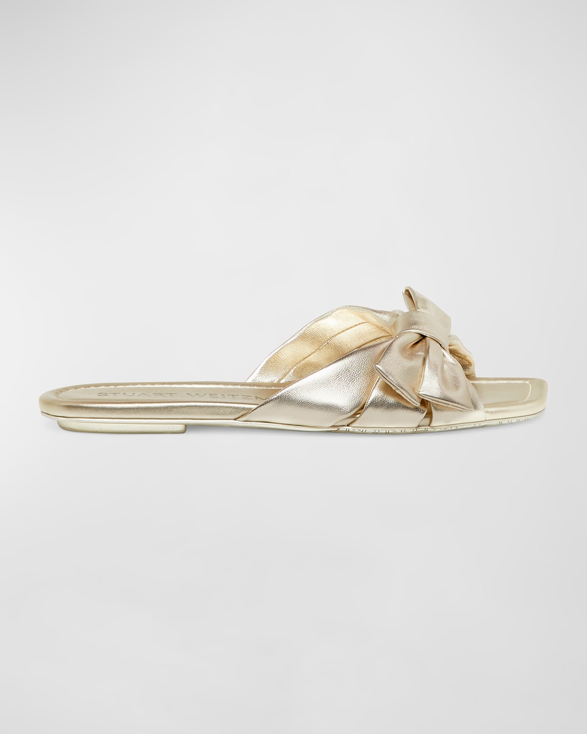 Shop Stuart Weitzman Sofia Metallic Bow Slide Sandals In Light Gold