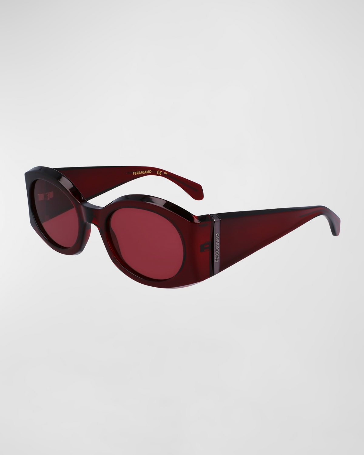 Shop Ferragamo Sculptural Plastic Oval Sunglasses In Transparent Burgundy