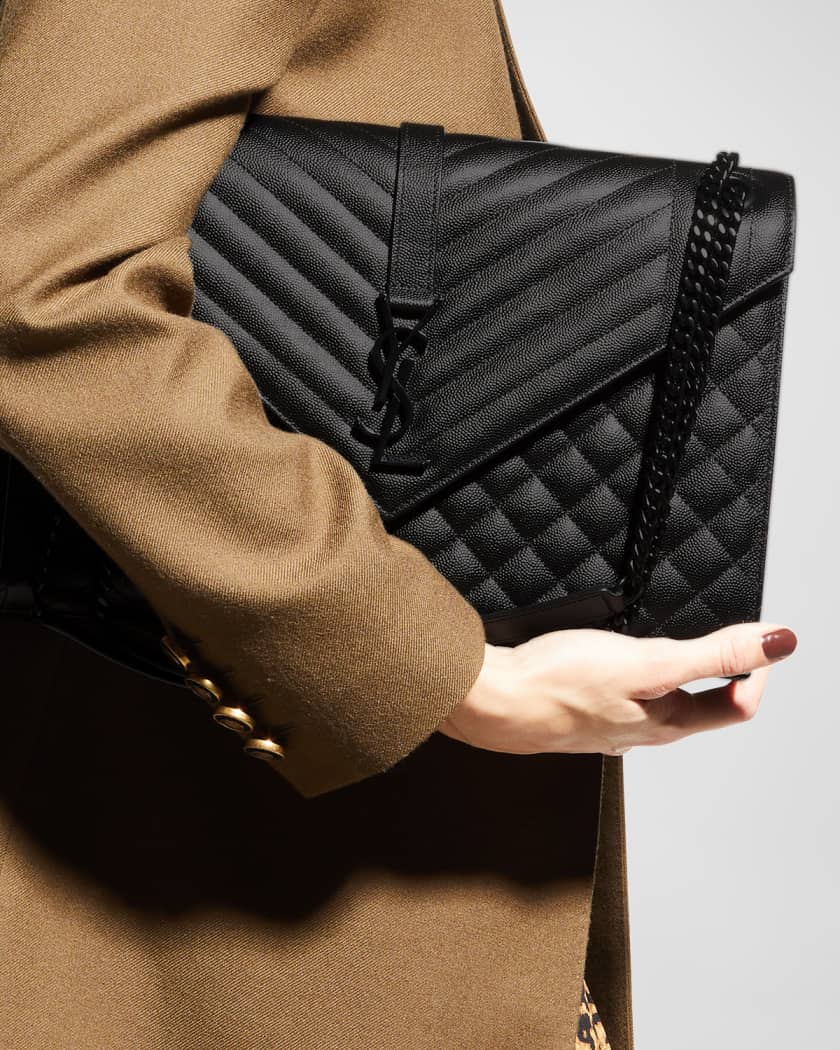 Shaped like a large envelope, SAINT LAURENT's quilted shoulder bag has been  made in Italy from durable blac…