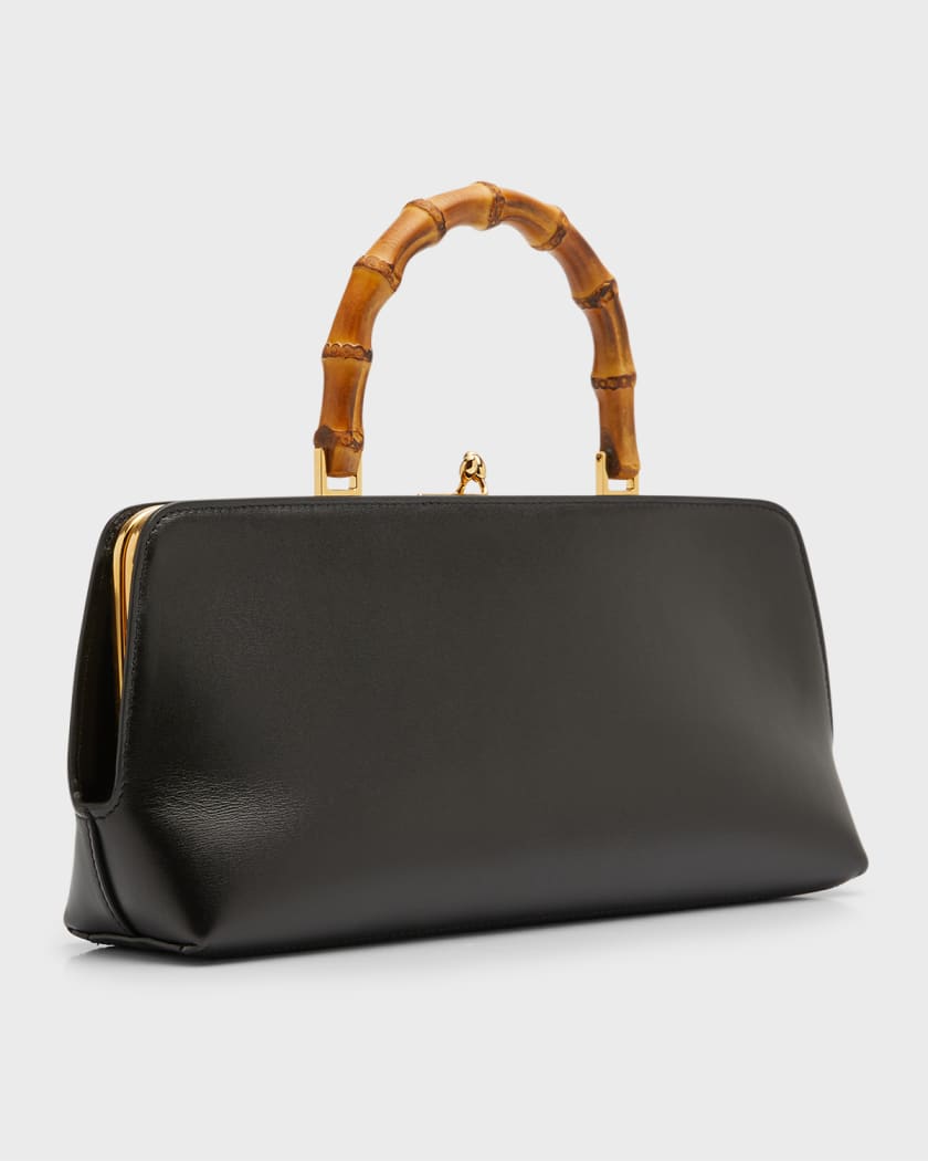 A UNIQUE BLACK LEATHER BAMBOO BAG WITH 18K YELLOW GOLD HANDLE