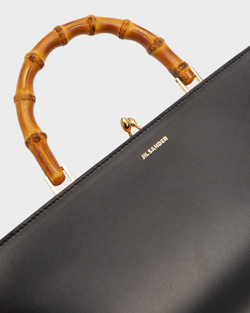 A UNIQUE BLACK LEATHER BAMBOO BAG WITH 18K YELLOW GOLD HANDLE