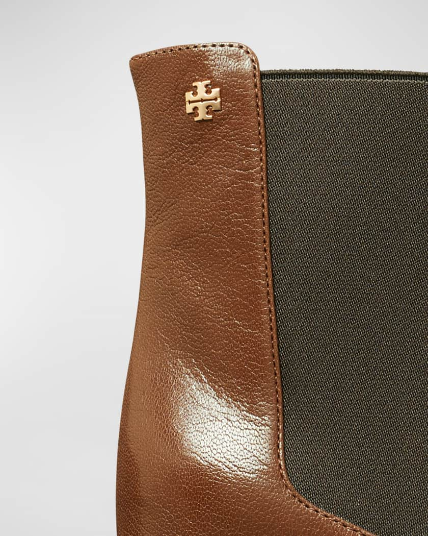 Tory Burch brown leather wallet with Tory emblem and Tory zipper pull