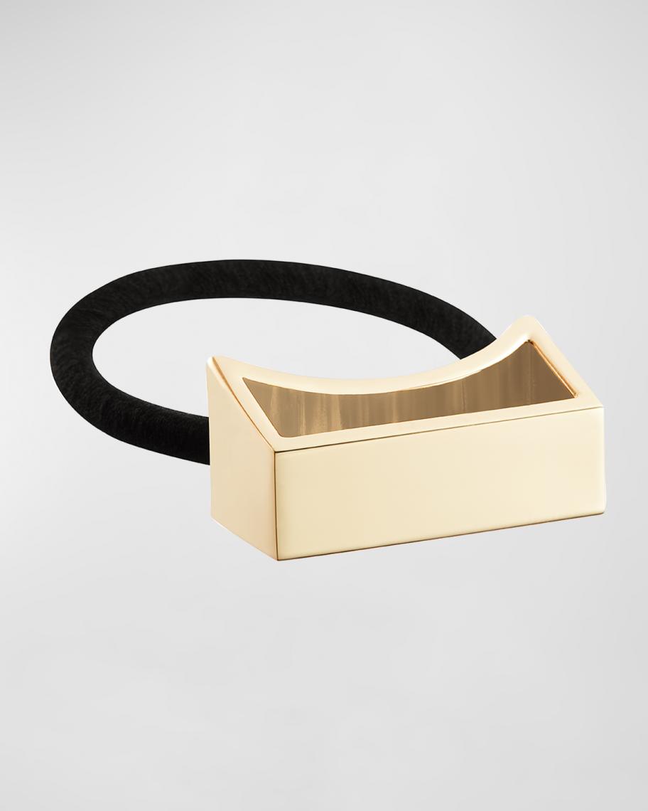 ORIBE gold plated metal pony tail holder with bag The Ponytail Cuff Trend Gives Cuffing Season a New Meaning  main image 4
