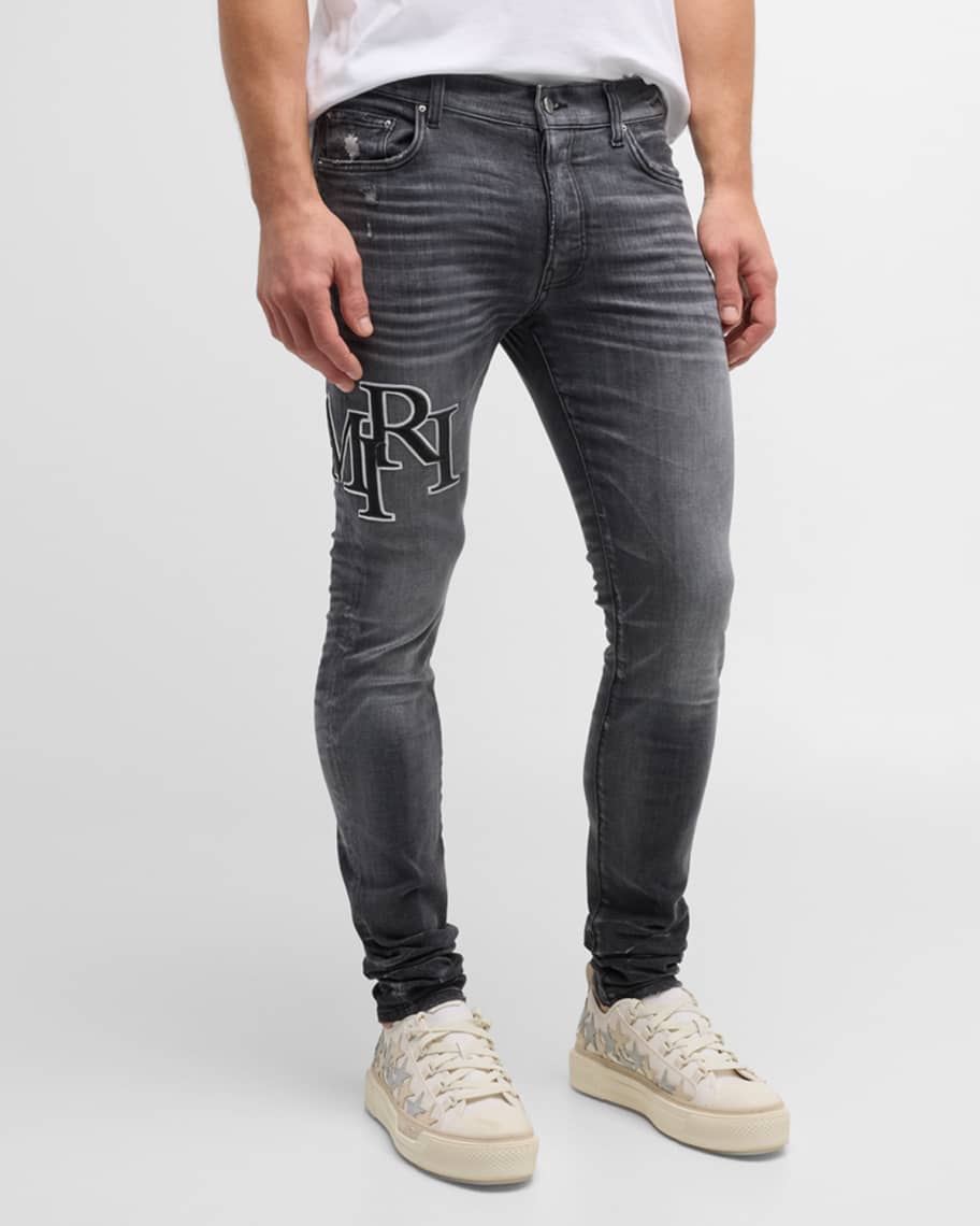 Amiri Men's Faded Skinny Jeans with Staggered Logo | Neiman Marcus