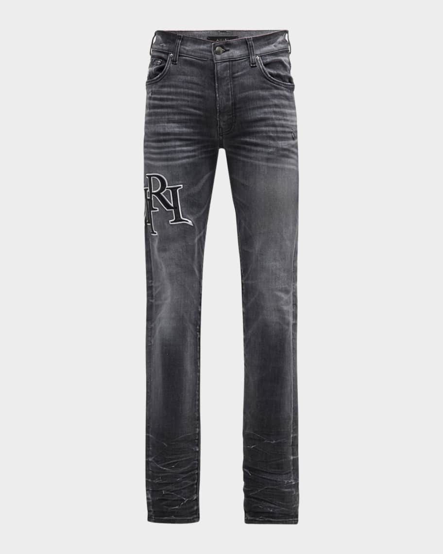Amiri Men s Faded Skinny Jeans with Staggered Logo Neiman Marcus