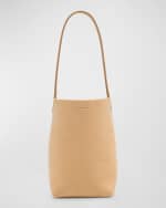 Image 1 of 6: THE ROW Park Small North-South Tote Bag in Nubuck Leather