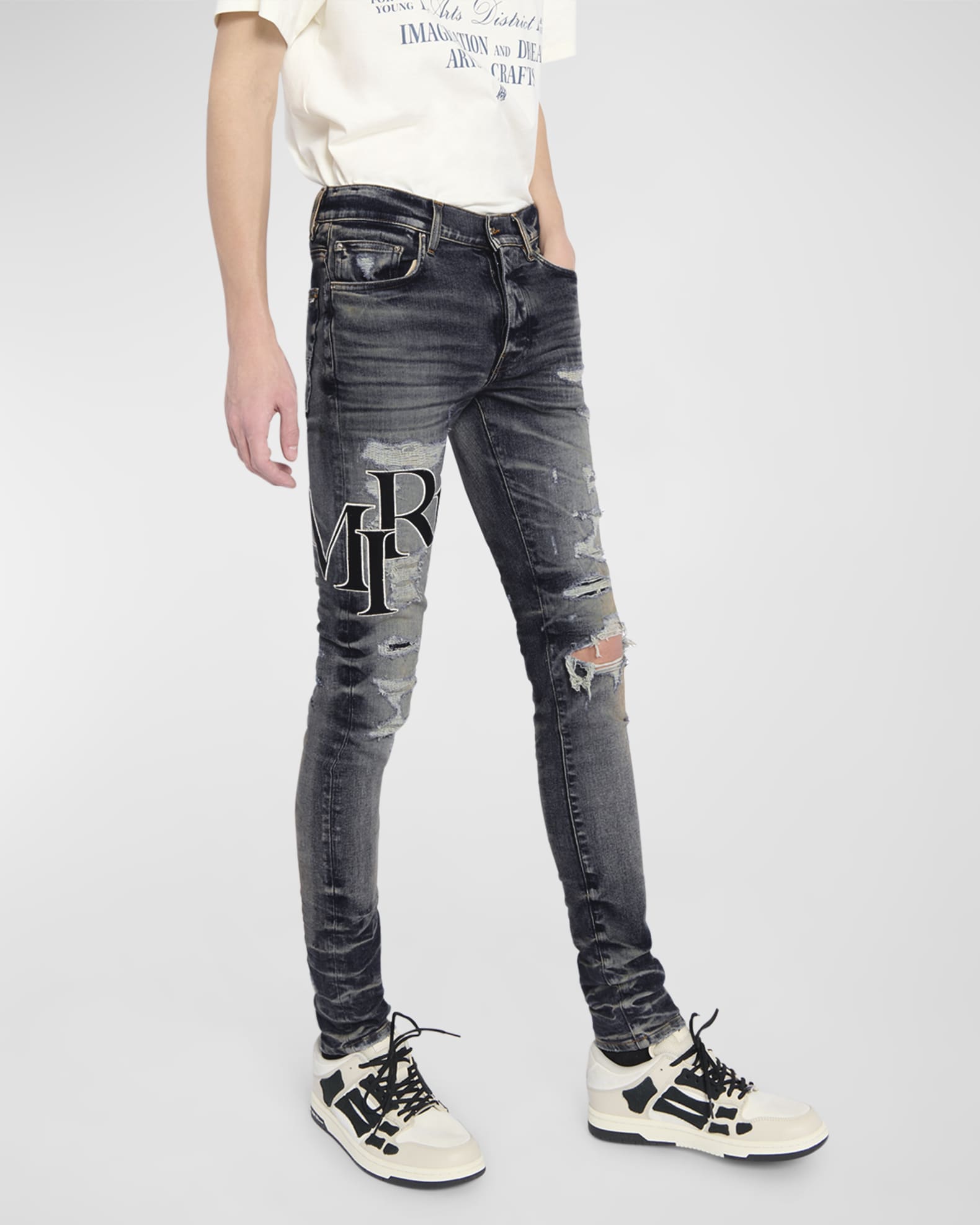Amiri Men's Staggered Logo Skinny Jeans | Neiman Marcus