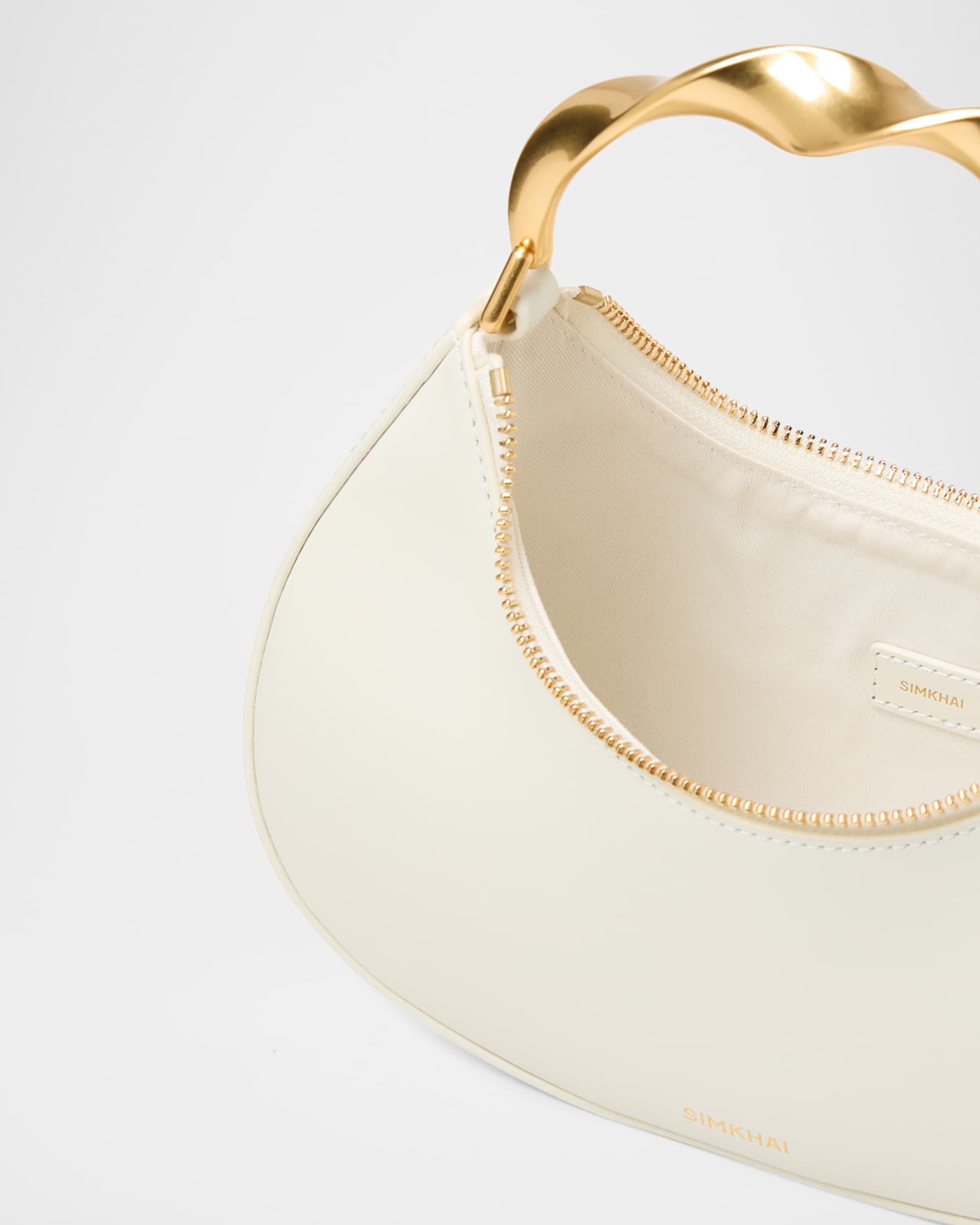 SIMKHAI Nixi Twist Leather Top-Handle Bag | Neiman Marcus