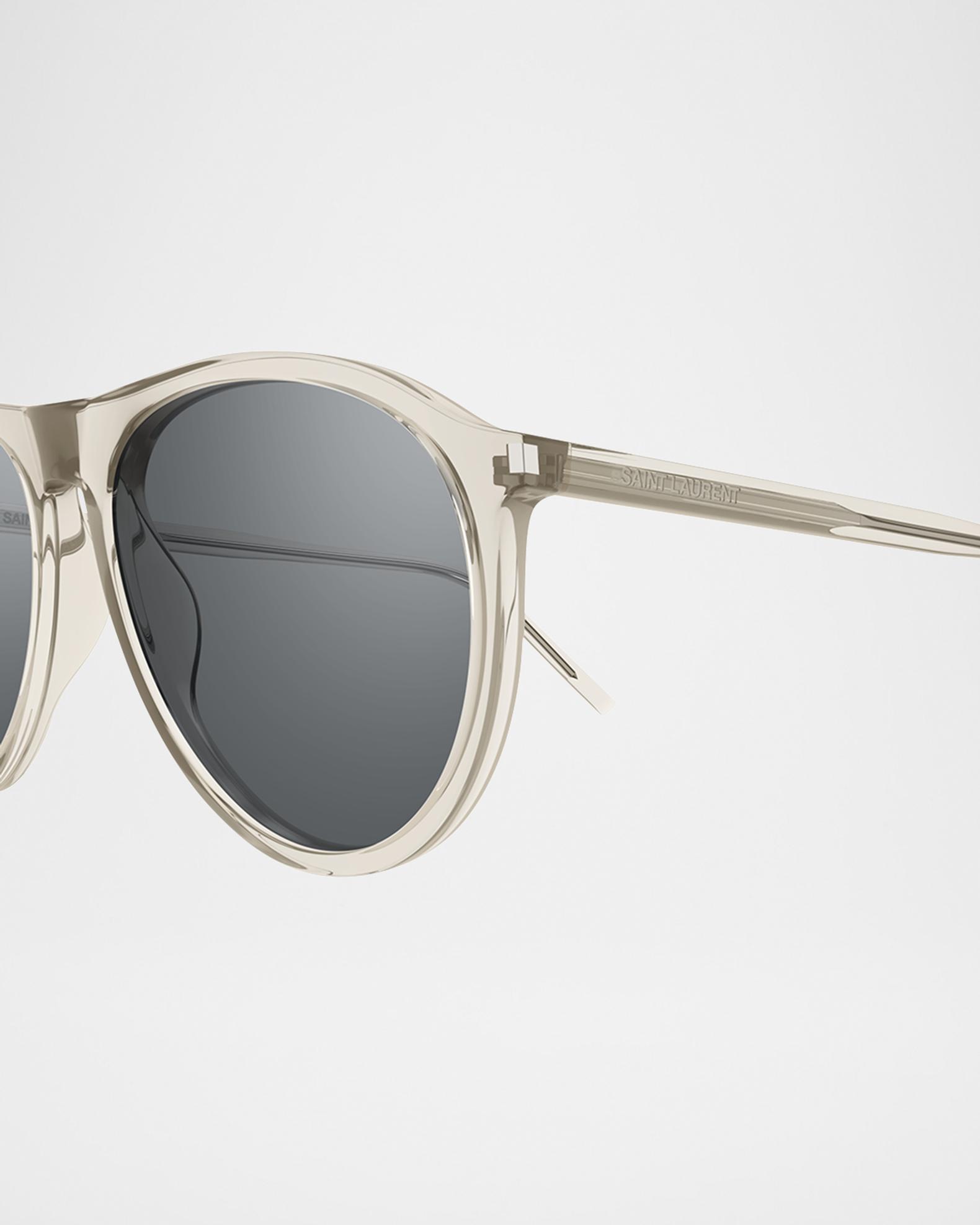 Saint Laurent Transparent/Clear Oval Sunglasses with Silver Lenses Saint Laurent SL 623 Sunglasses 004 Transparent Beige - eye  main image 3