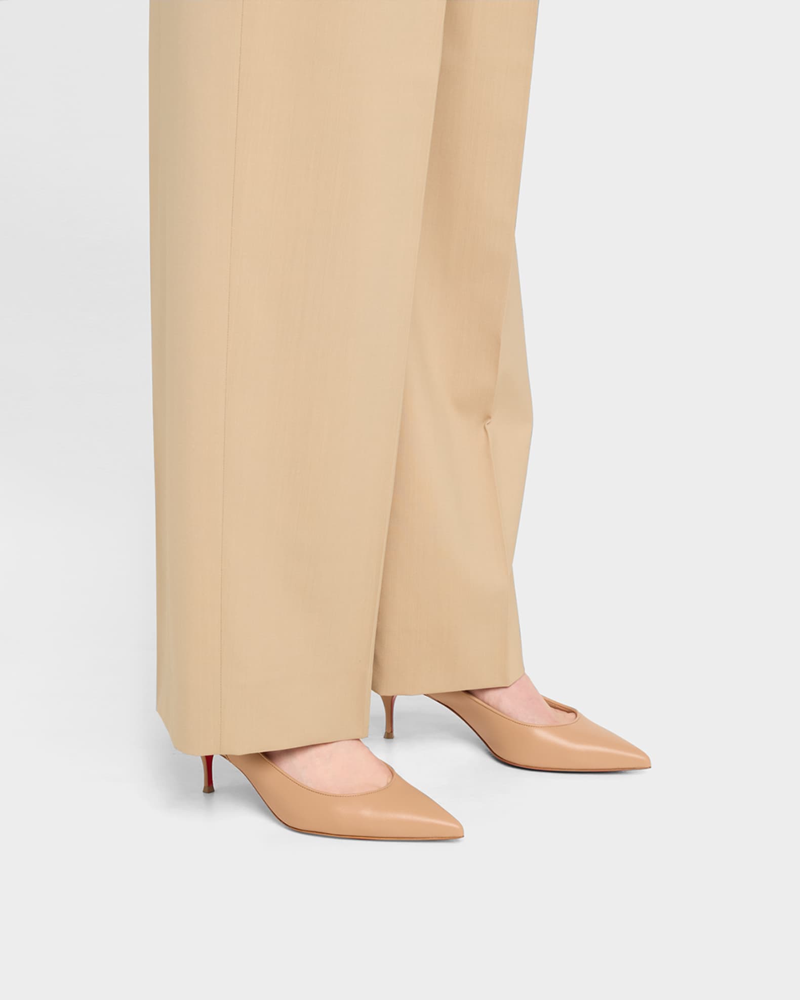 Sporty Kate Red Sole Slingback Pumps 1