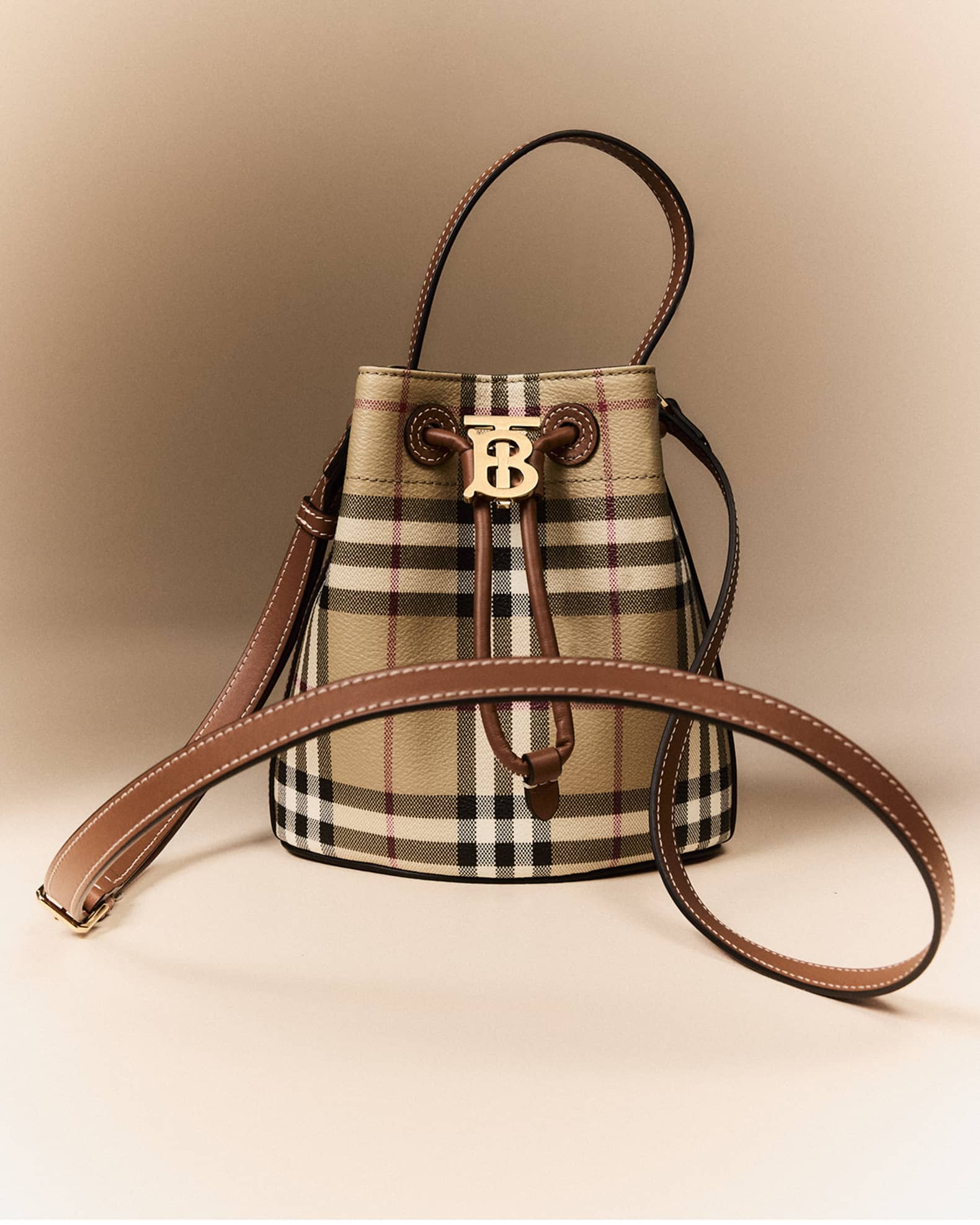 【Burberry】Mini Drawstring Bucket Bag Sand Burberry Mini Drawstring Bucket Bag in Sand | FWRD