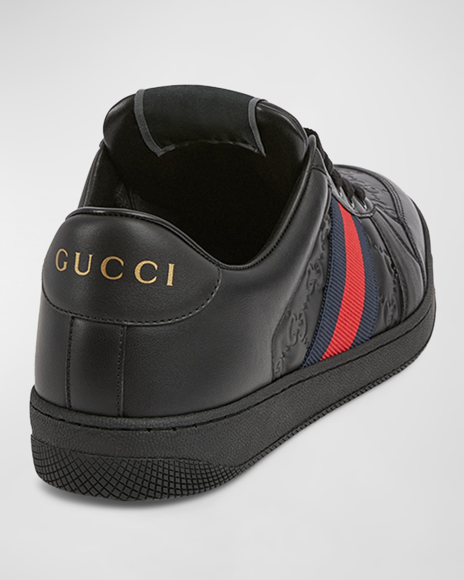 GG Embossed Leather Low Top Sneakers