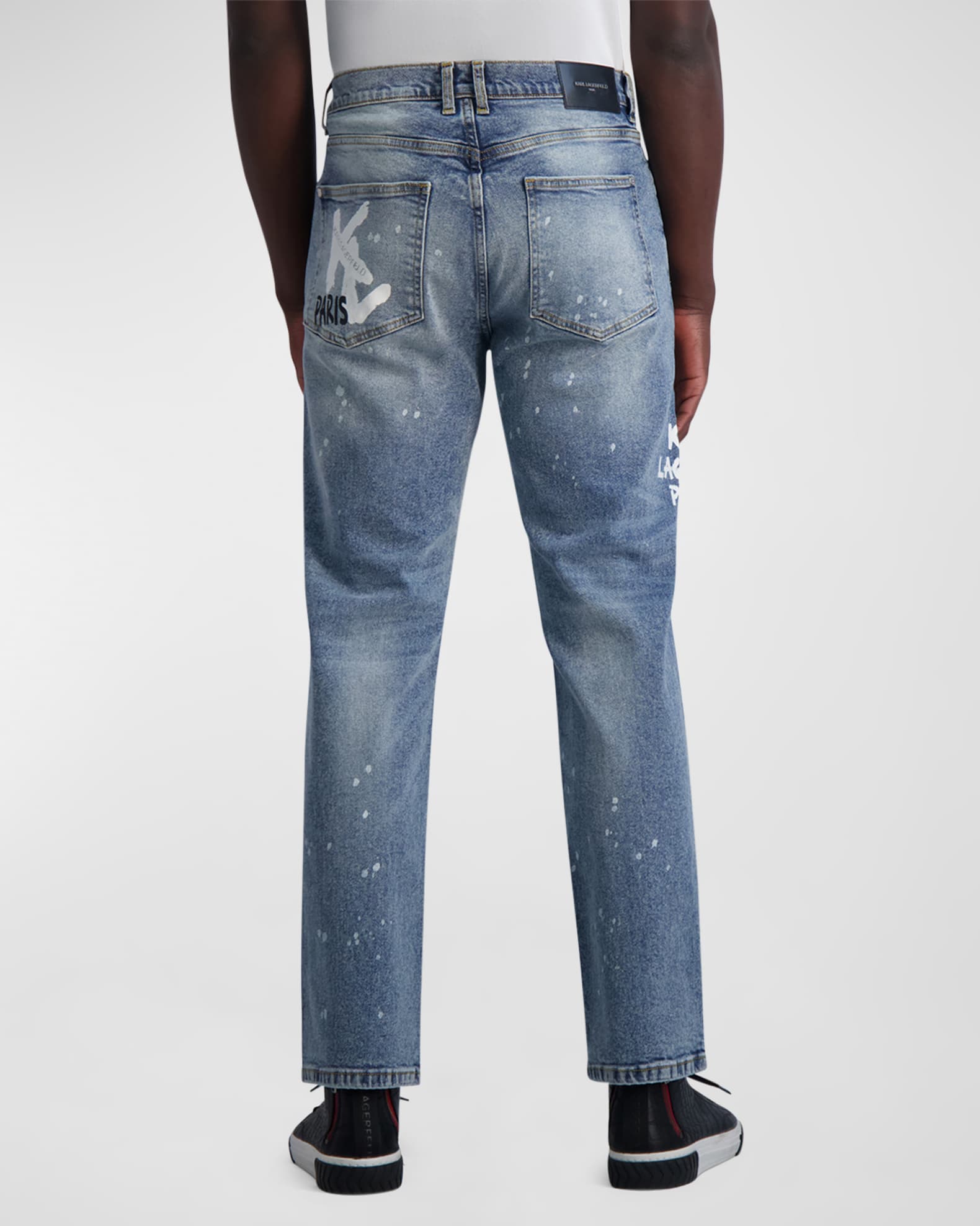 Blue jeans with paint splatter top